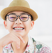 young smiling boy with braces
