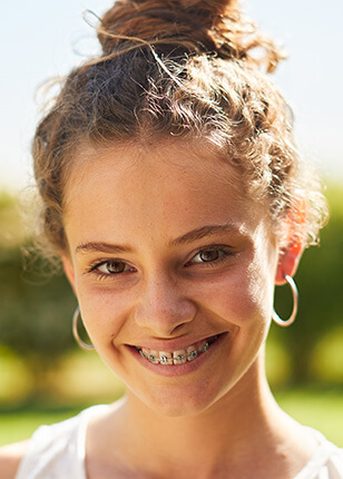 young smiling girl with braces